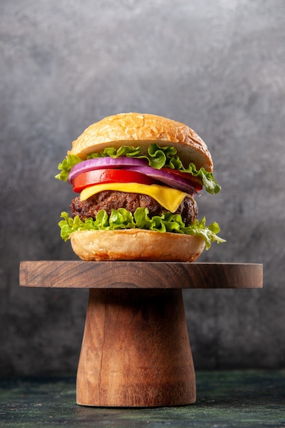 Free photo tasty sandwich on wooden board on dark mix color surface with free space