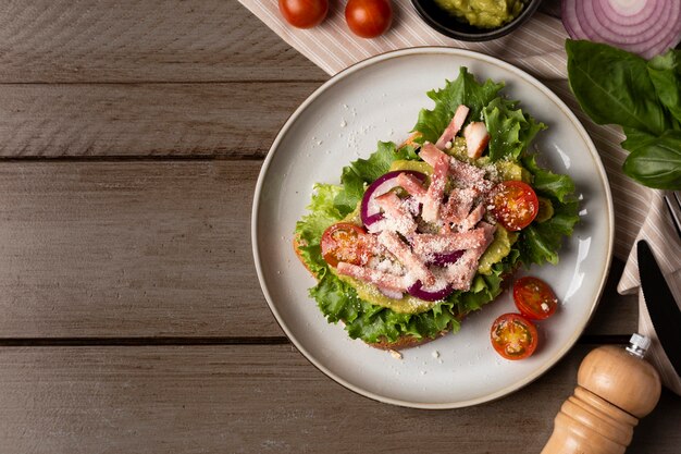 Tasty sandwich on wooden table top view