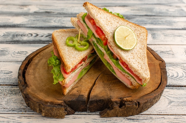 tasty sandwiches on wooden desk