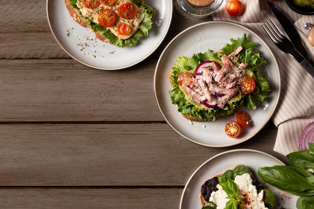 Tasty sandwiches on wooden table