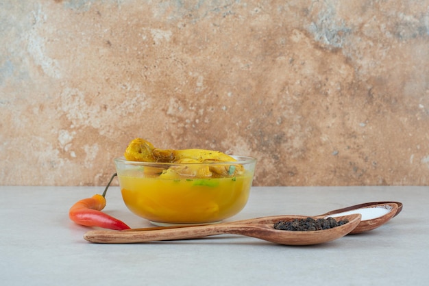 Free photo tasty soup with spices and chili pepper on white table.