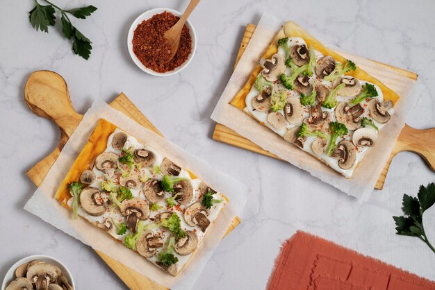 Tasty square pizzas on wooden board