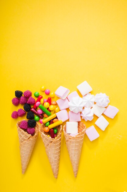 Tasty sweets in waffle cones