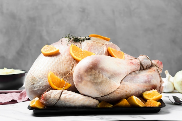 Tasty tied up turkey with herbs and orange