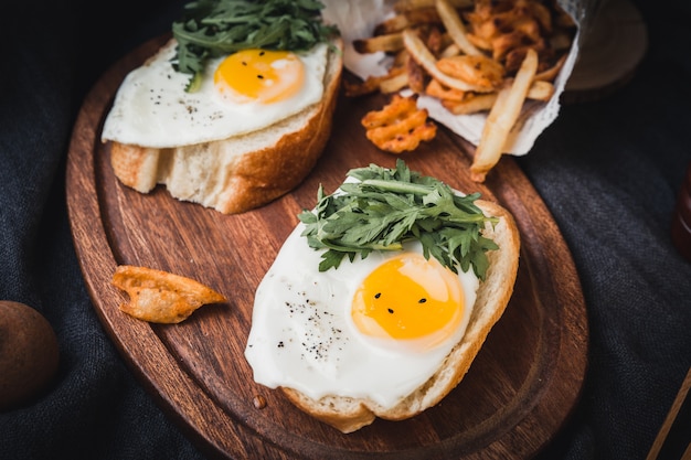 Tasty toasts with fried eggs