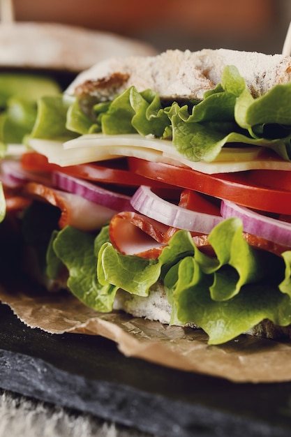 Tasty vegan sandwich over wooden table