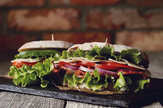 Tasty vegan sandwich over wooden table