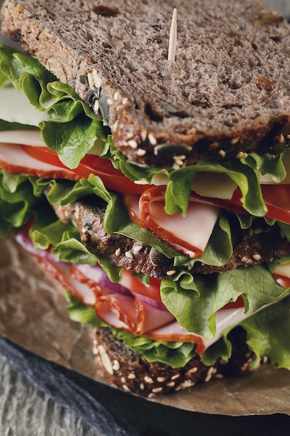 Tasty vegan sandwich over wooden table