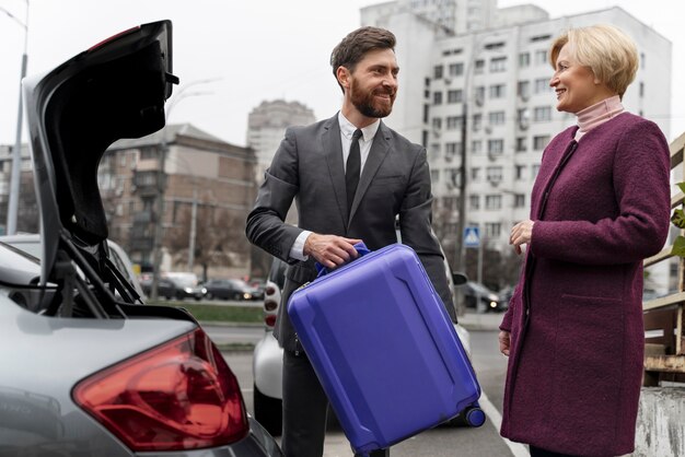 Taxi driver and female client interacting in a formal way