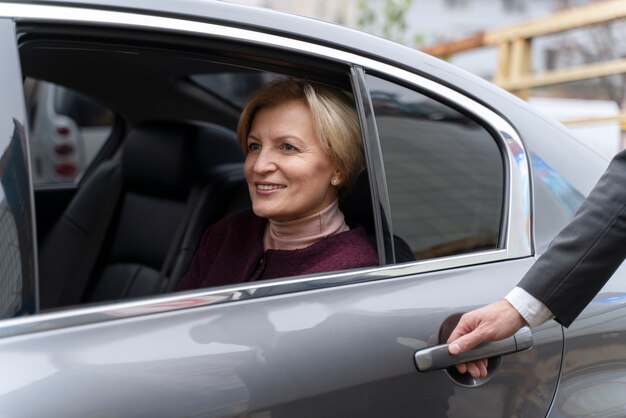 Taxi driver and female client interacting in a formal way