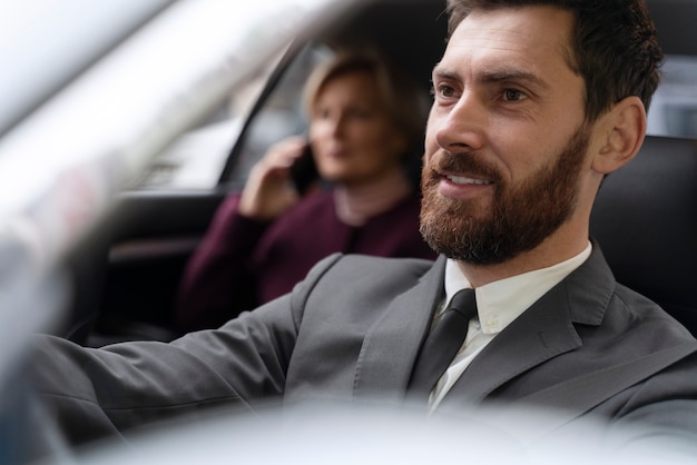 Taxi driver and female client interacting in a formal way