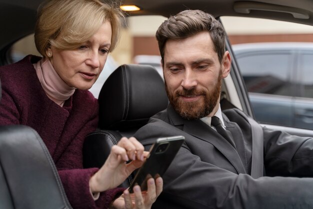 Taxi driver and female client interacting in a formal way