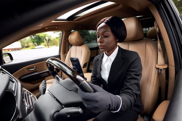 Taxi driver waiting for her client