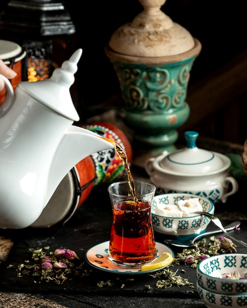tea black tea with slice of lemon turkish delight and dried flowers
