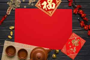 Free photo tea ceremony supplies near red paper