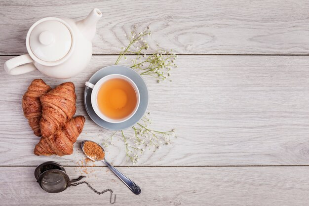Tea and croissants in copy space