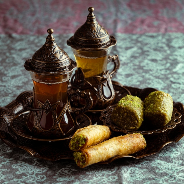 Tea cups arrangement with food