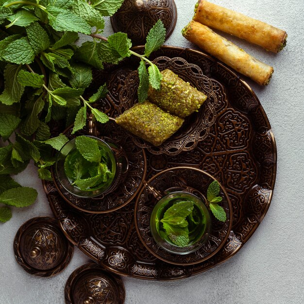 Tea cups and food arrangement flat lay