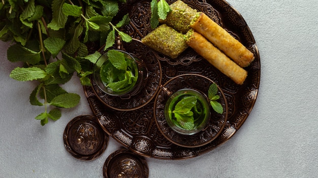 Tea cups and food arrangement top view