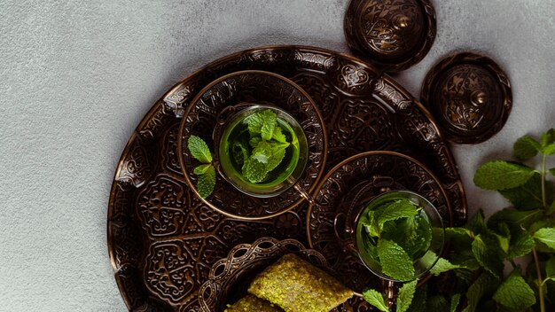 Tea cups and food arrangement above view