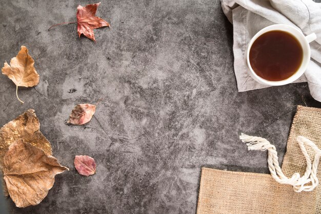 Tea and dry foliage on shabby surface