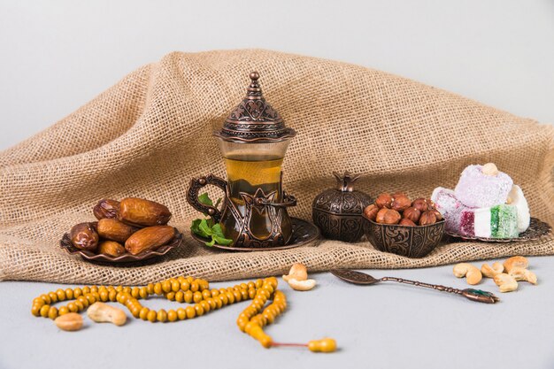 Tea glass with eastern sweets and beads 