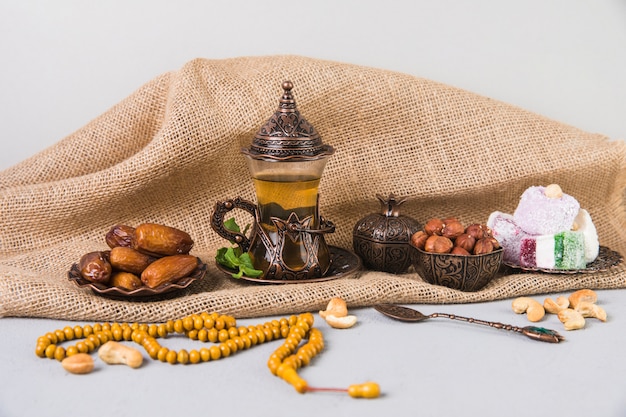 Tea glass with eastern sweets and beads 