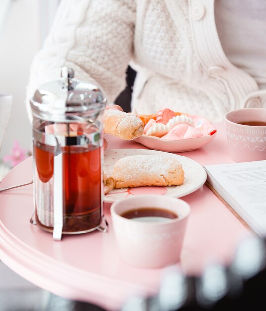 Tea kettle and shortbread cookies on the table