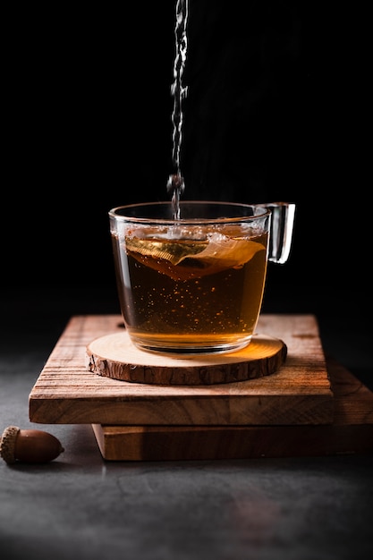 Tea pouring in cup studio shot