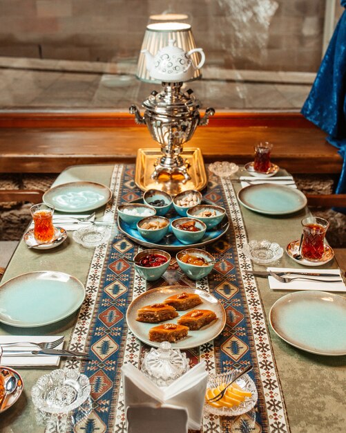 Tea set with baklava, jams, lemon and dried fruits