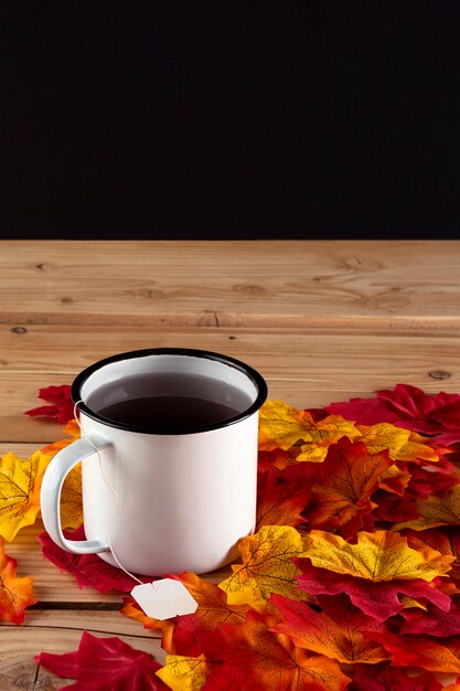 Tea with autumn leaves