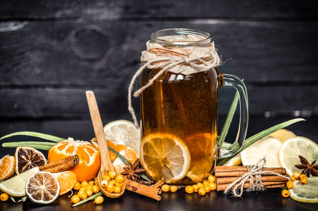 tea with lemon on a black background