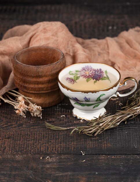 Tea with  lemon and dried flowers on the table