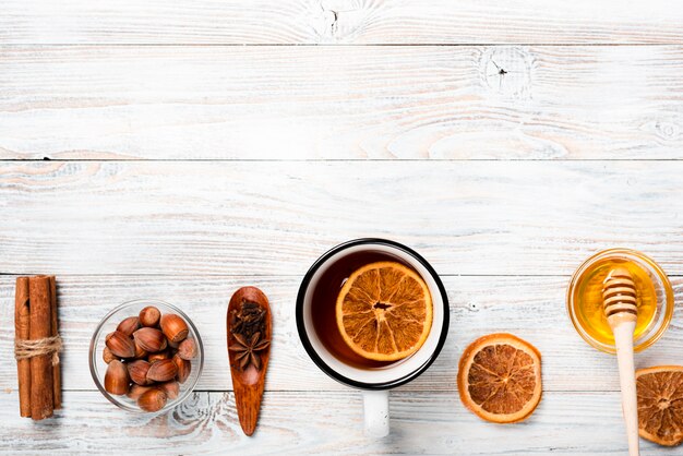 Tea with orange, honey and copy space