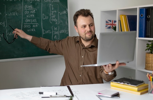 Teacher doing an english lesson online for his students