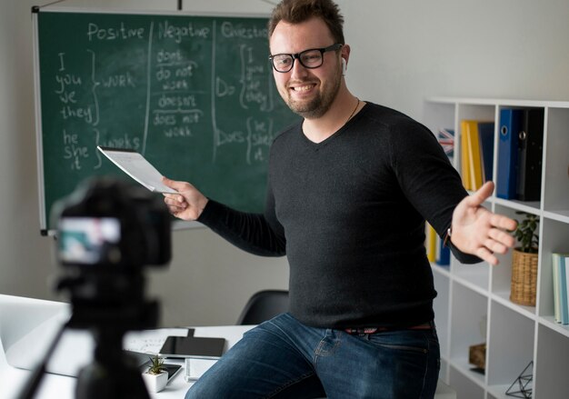 Teacher doing an english lesson online for his students