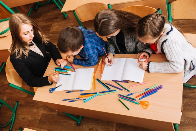 Teacher explains subject to pupils