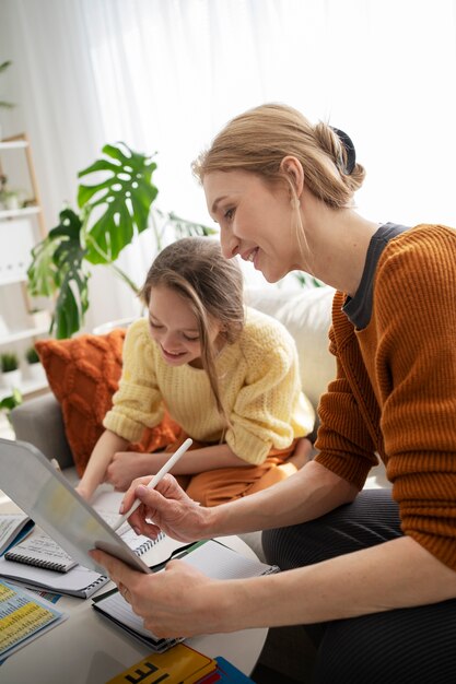 Teacher helping girl learning english