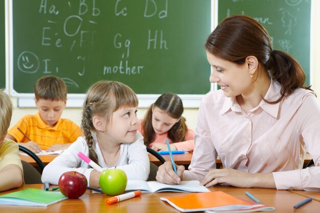 Teacher helping her student