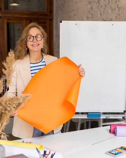 Teacher holding flipchart