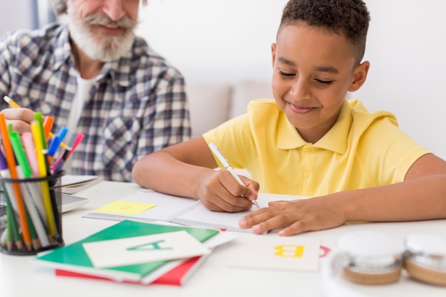 Teacher looking at student writing