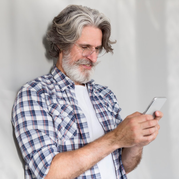 Teacher standing and using phone