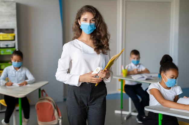 Teacher and student wearing face masks