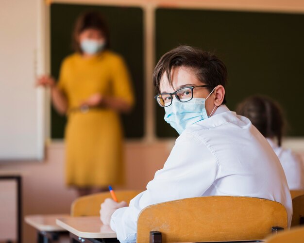 Teacher and students with mask