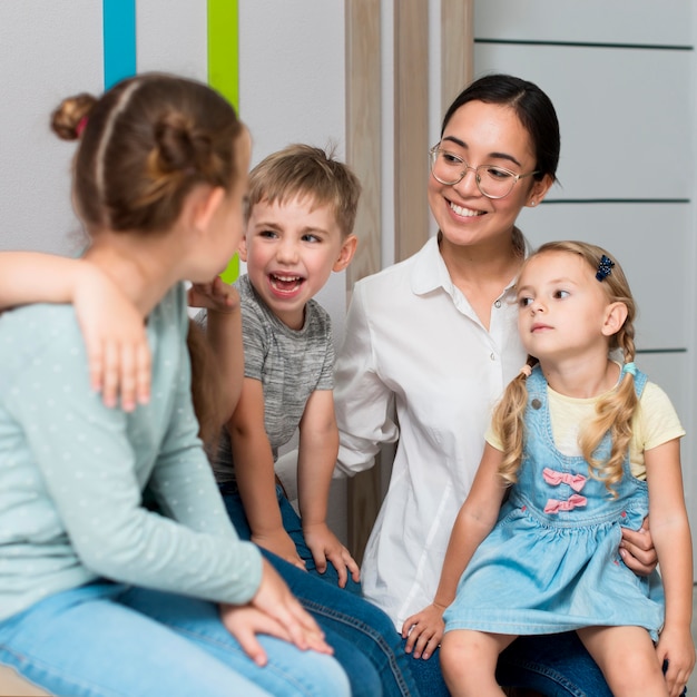 Teacher talking with her students