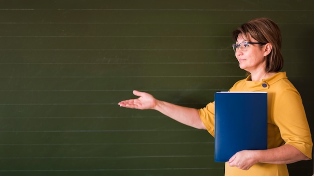 Teacherpresenting at chalkboard