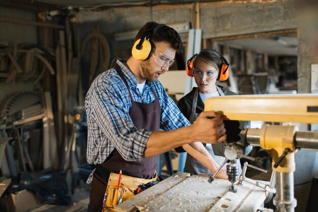 Teaching apprentice to use drill press