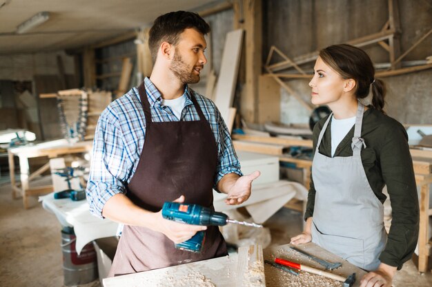 Teaching apprentice to use electric drill