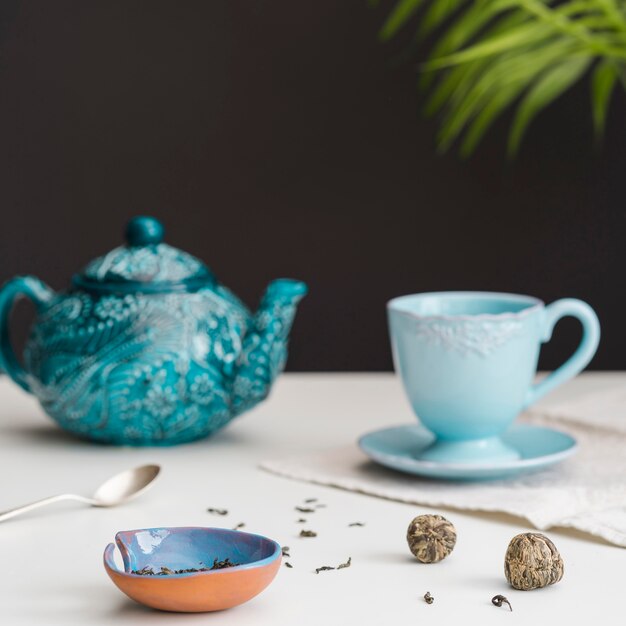 Teacup and teapot on table