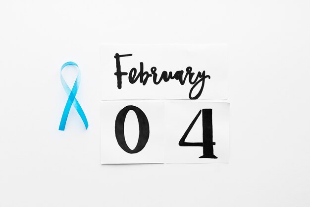 Teal ribbon near February 4 writing